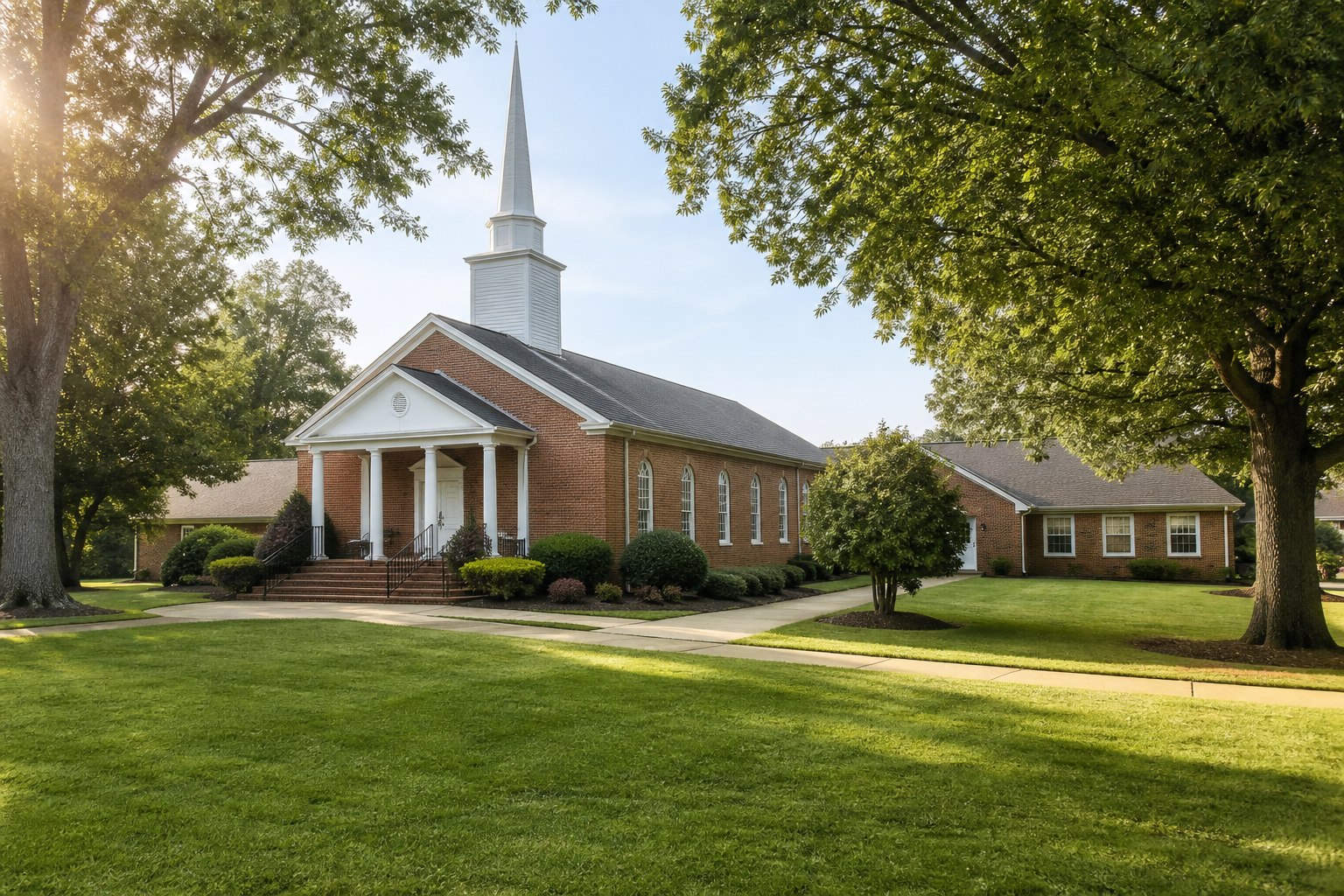 A welcoming brick church campus with a sanctuary and education wing